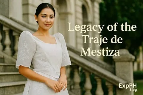 A young Filipino woman wearing a traditional white traje de mestiza stands on stone steps of an old building with the ExpPH Blog logo in the corner.
