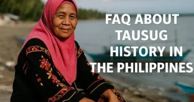 An elderly Tausug woman wearing a bright pink hijab and traditional embroidered clothing sits along a quiet coastal shore, with boats and palm trees in the background. The text reads FAQ About Tausug History in the Philippines, and the ExpPH Blog logo appears at the lower right.