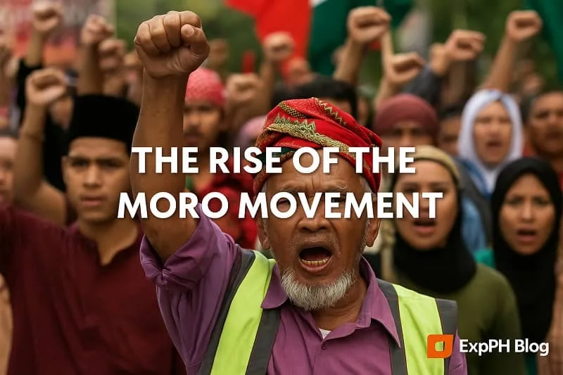 A Tausug elder wearing traditional red and gold attire stands on a quiet shore with wooden boats and mountains in the background, symbolizing heritage, strength, and cultural pride. The text overlay reads Tausug History in the Philippines A Story of Faith, Strength, and Freedom, with the ExpPH Blog logo displayed on the lower right.