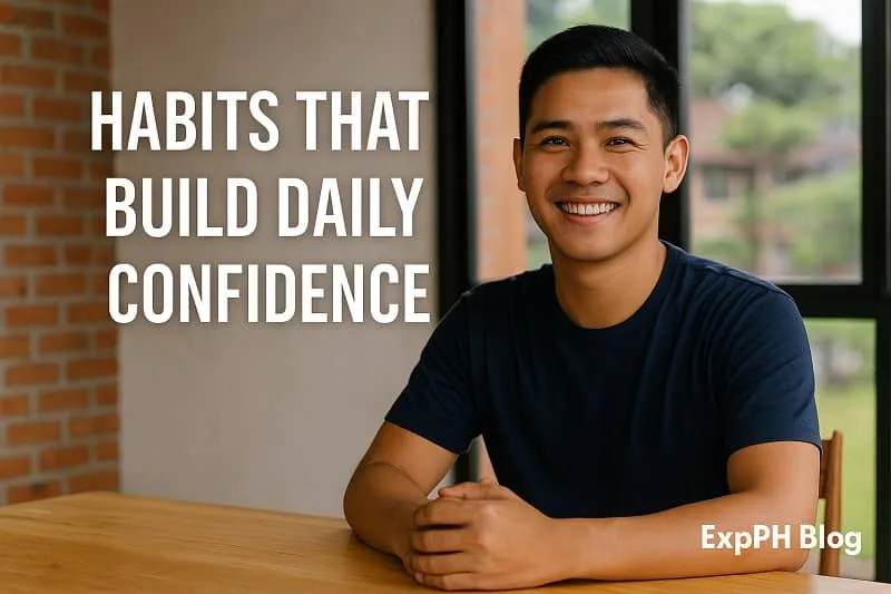 Filipino man smiling at a table with confidence, representing daily habits that improve self belief.