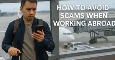 Filipino traveler checking his phone at an airport while preparing to work abroad with ExpPH Blog logo.