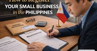 Filipino entrepreneur filling out business registration form with Philippine flag and documents labeled small business on desk with ExpPH Blog logo