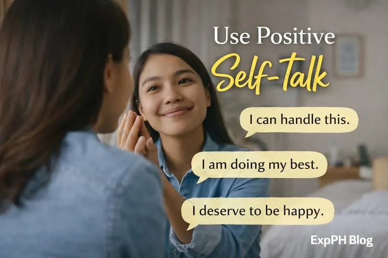 A Filipino woman smiling at her reflection while practicing positive self-talk, representing confidence, self-belief, and emotional strength.