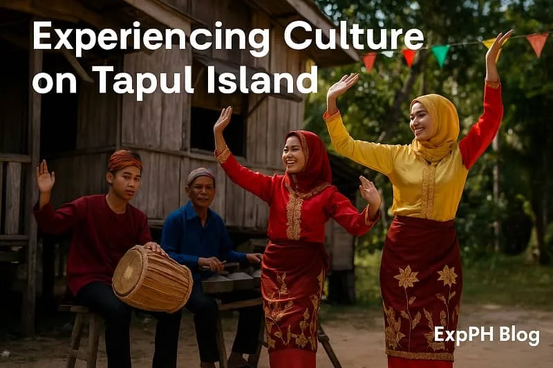 A realistic scene of Tausug performers dancing and playing traditional instruments on Tapul Island, with colorful attire, a wooden stilt house, and the ExpPH Blog logo.