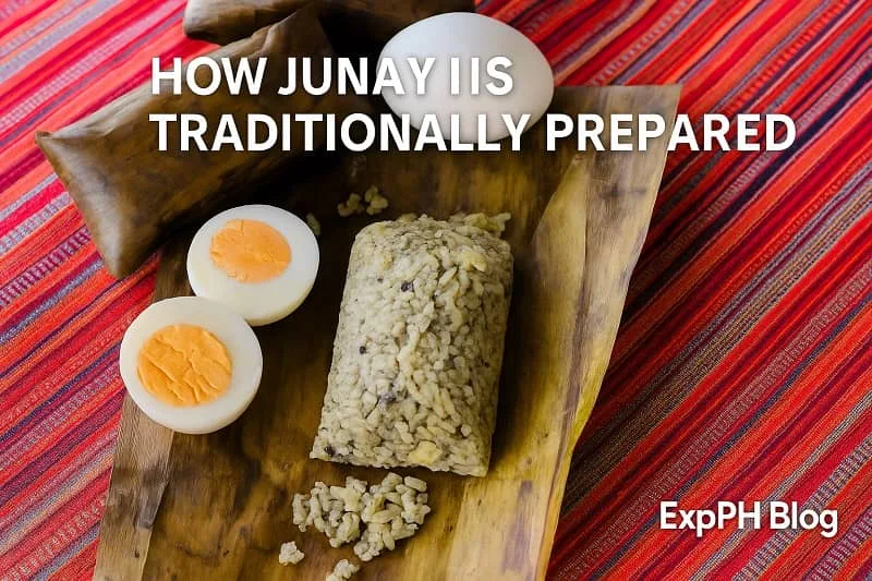 A realistic display of traditional Junay unwrapped on banana leaves with boiled eggs on a colorful woven Tausug fabric background, featuring the ExpPH Blog logo.