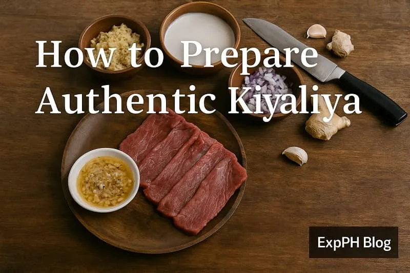 A realistic top view of sliced beef, chopped aromatics, coconut milk, and kitchen tools arranged for preparing authentic Kiyaliya, with the ExpPH Blog logo included.