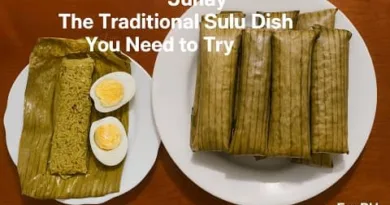A plate of traditional Sulu Junay wrapped in banana leaves, with one unwrapped Junay served beside sliced hard boiled eggs on a white plate.