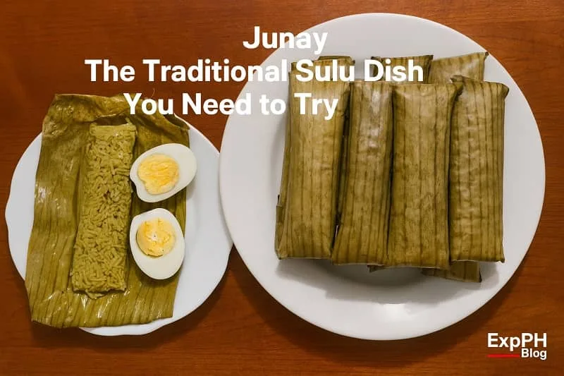 A plate of traditional Sulu Junay wrapped in banana leaves, with one unwrapped Junay served beside sliced hard boiled eggs on a white plate.