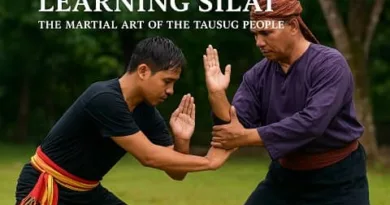 Two Tausug martial artists practicing realistic Silat techniques outdoors with the ExpPH Blog logo.