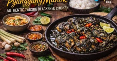 Authentic Tausug blackened chicken Pyanggang Manok served in a rustic Filipino setting with rice and side dishes, featuring ExpPH Blog logo