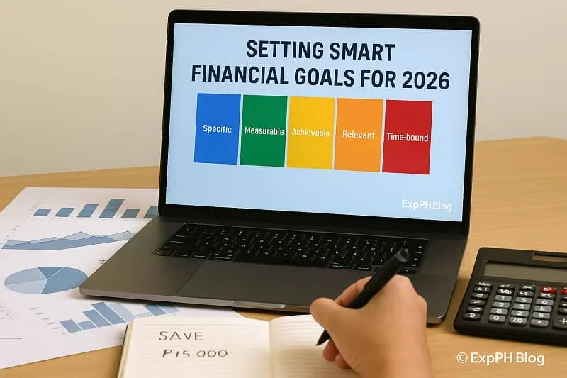 A realistic photo of a laptop displaying SMART financial goals for 2026, with charts, a calculator, and a notebook showing written savings goals, including the ExpPH Blog logo.