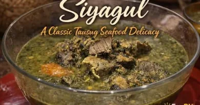 Siyagul Tausug seafood made with squid and stingray cooked in coconut milk and spices, served in a traditional Filipino glass bowl from Sulu cuisine