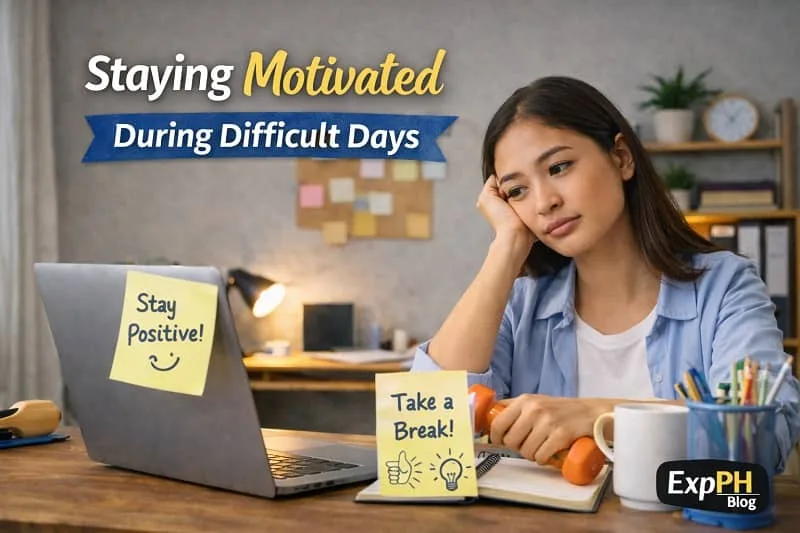 Filipino remote worker looking tired at a home desk with laptop and motivational notes, showing staying motivated during difficult days with ExpPH Blog logo