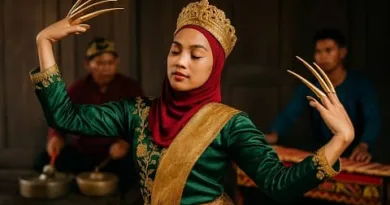 A Tausug dancer performing the Pangalay Dance with janggay while visitors watch in a traditional setting.