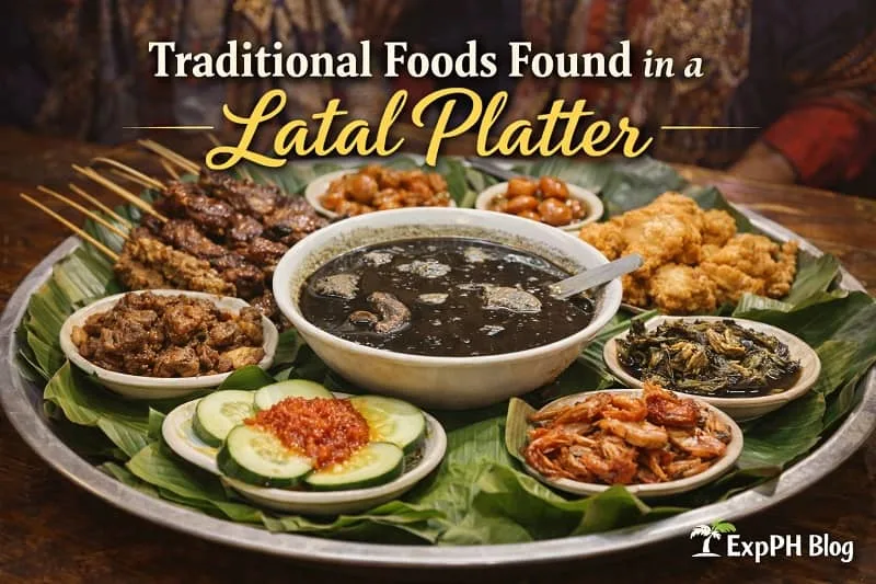 Traditional Tausug latal platter featuring tiyula itum, fried dishes, grilled meat, seafood, vegetables, and sauces arranged on banana leaves in a communal tray