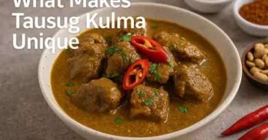 A realistic bowl of Tausug Kulma curry with tender beef, rich coconut based sauce, red chilies, spices, and ExpPH Blog logo.