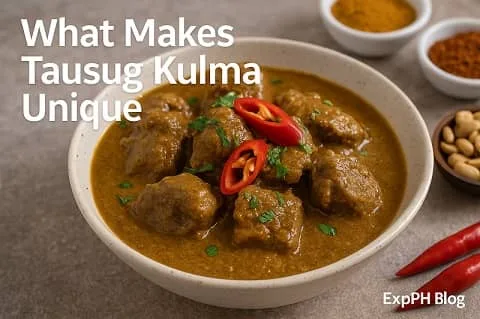 A realistic bowl of Tausug Kulma curry with tender beef, rich coconut based sauce, red chilies, spices, and ExpPH Blog logo.
