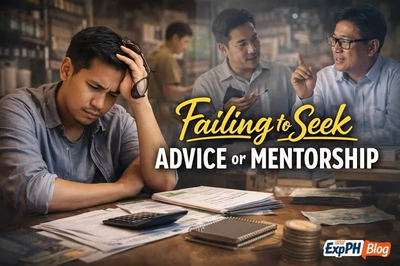 Filipino entrepreneur looking stressed while handling business paperwork alone, with blurred figures of mentors in the background symbolizing missed guidance and support.