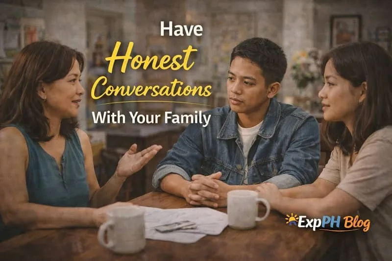 Filipino family sitting together at a dining table having a serious but calm conversation at home