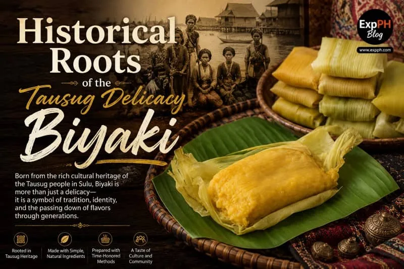 Traditional Tausug Biyaki delicacy wrapped in corn husks and displayed on a banana leaf, with historical Tausug imagery and cultural elements representing the heritage of Sulu, featuring the ExpPH Blog logo.