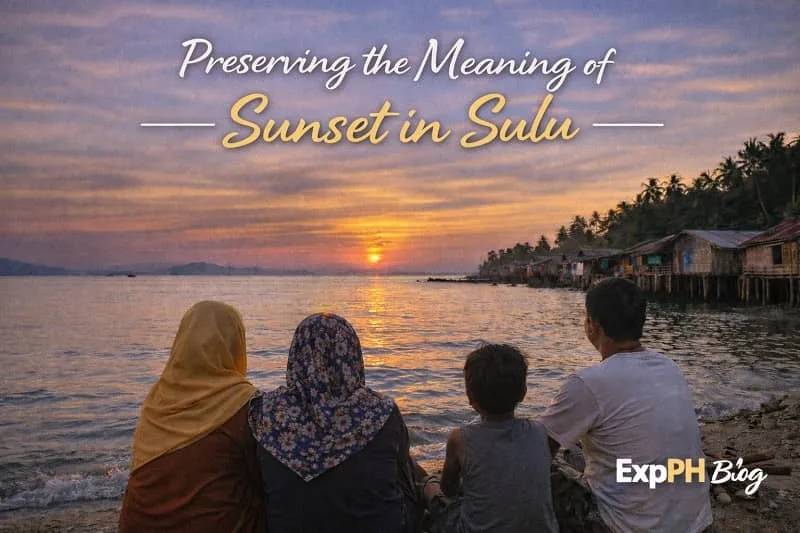 Filipino families quietly watching the sunset in a coastal community in Sulu with stilt houses and calm sea