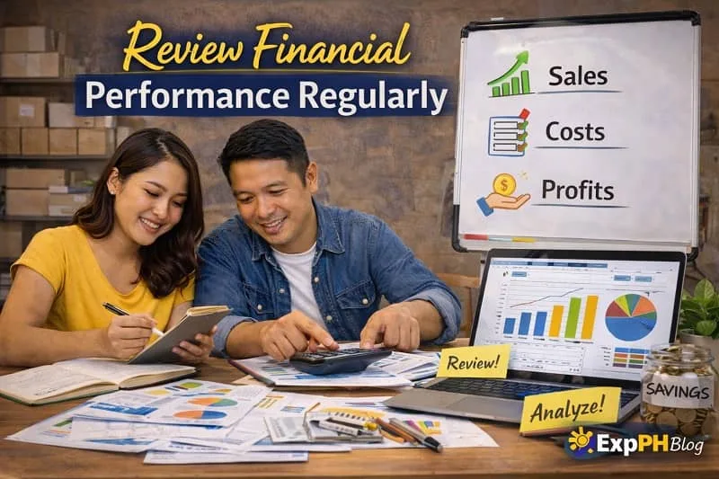 Filipino small business owners reviewing financial reports, charts, and sales data using a calculator and laptop to monitor business performance.